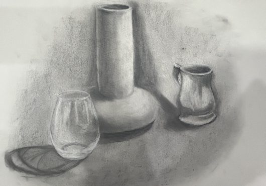 Charcoal still life drawing of a vase and two cups.